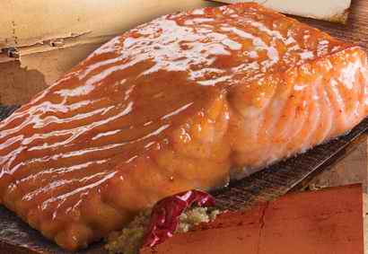 Salmon portions with seasoning topping